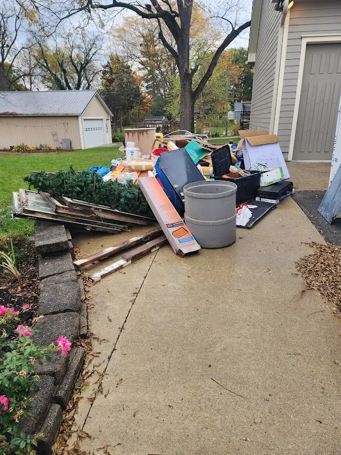 Dumpster being loaded with debris for Commercial Dumpster Rental in Hahnville